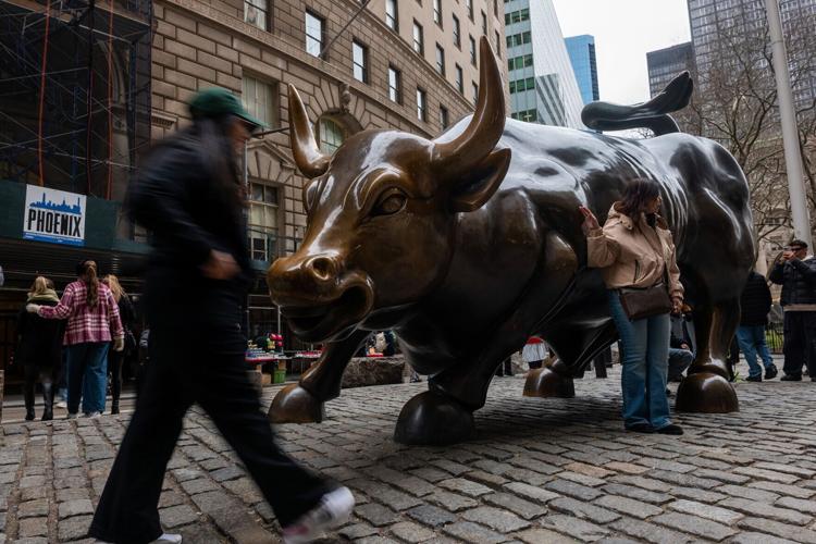 The Wall Street Bull stands in the Financial District, home to the New York Stock Exchange, in Manhattan on March 19, 2026, in New York City.