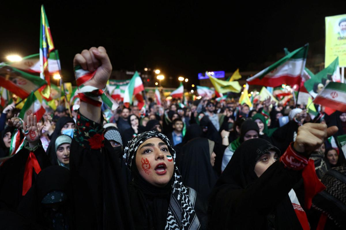 People chant during a rally in Tehran