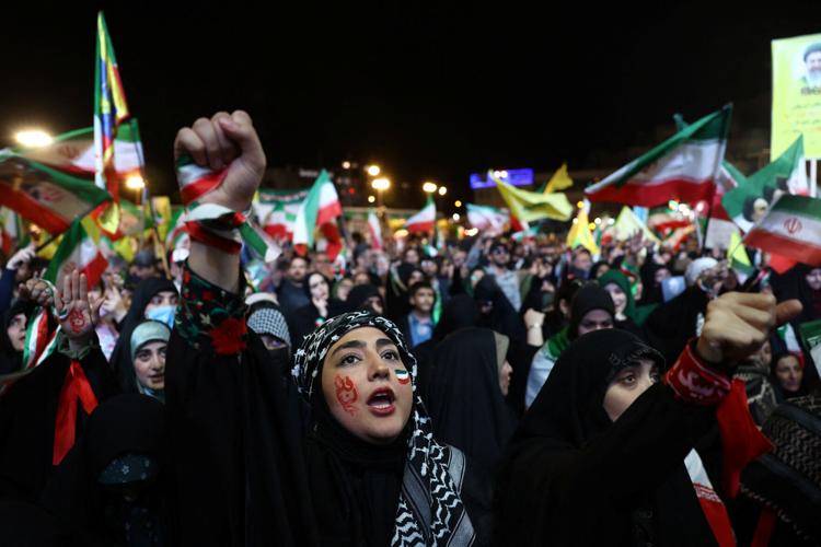 People chant during a rally in Tehran