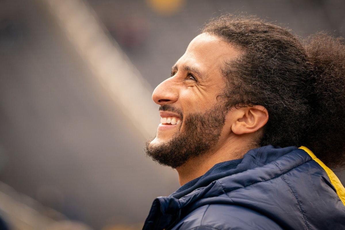 Colin Kaepernick interacts with fans during the Michigan spring football game at Michigan Stadium on April 2, 2022 in Ann Arbor, Michigan.