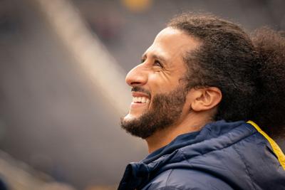 Colin Kaepernick interacts with fans during the Michigan spring football game at Michigan Stadium on April 2, 2022 in Ann Arbor, Michigan.