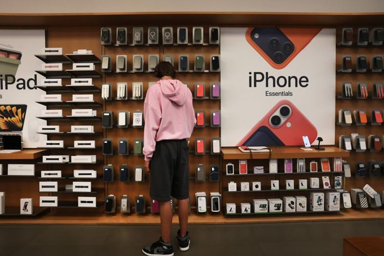 A shopper browses at an Apple store in lower Manhattan on July 30, 2026, in New York. (Spencer Platt/Getty Images/TNS)