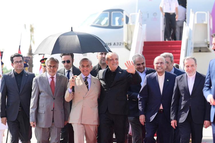 President of Iran Masoud Pezeshkian is received by Pakistan's Prime Minister Shehbaz Sharif and President Asif Ali Zardari upon his arrival at Nur Khan Airbase in Rawalpindi