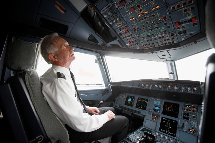 FILE PHOTO: Capt. Sullenberger goes through his pre-flight routine before piloting a flight to North Carolina from LaGuardia Airport in New York