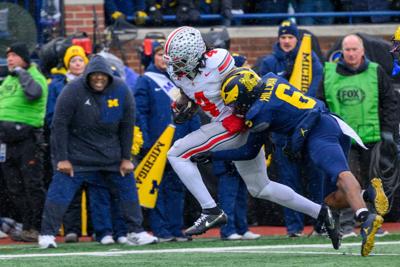 Ohio State wide receiver Jeremiah Smith beats Michigan defensive back Brandyn Hillman to the end zone for a 35- yard touchdown pass in the second quarter at Michigan Stadium on Saturday, Nov. 29, 2025, in Ann Arbor, Michigan.