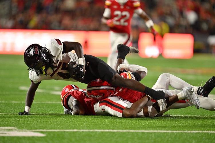 Sep 5, 2025; College Park, Maryland, USA;  Northern Illinois Huskies running back Telly Johnson Jr. (45) is brought down after a short gain in the second half against the Maryland Terrapins at SECU Stadium. Mandatory Credit: Jamie Sabau-Imagn Images