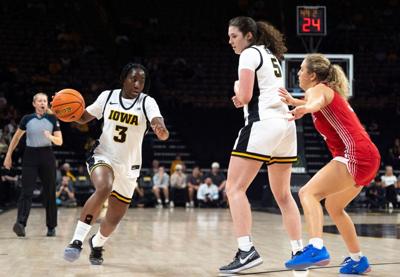 Iowa guard Dani Carnegie (3) dribbles toward the basket as Iowa center Ava Heiden (5) screens Maryville’s Adylan Ayer (33) Oct.