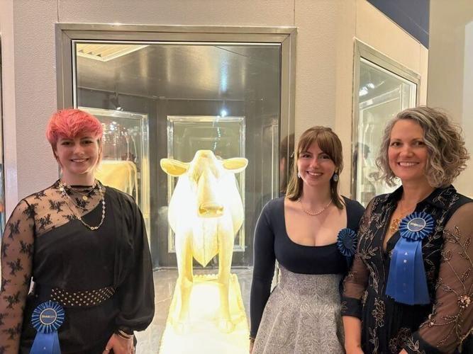 Grace and Hannah Pratt pose with their mom, Sarah Pratt, at the opening party for the Smithsonian's State Fairs exhibit at the Renwick Gallery in Washington D.C.