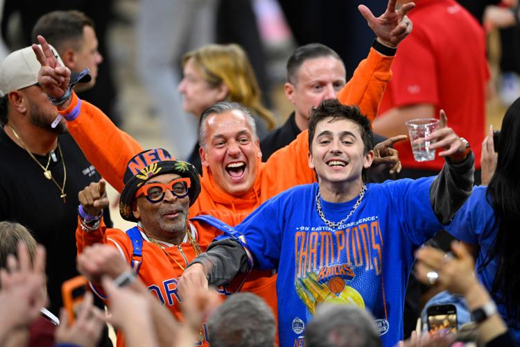 Spike Lee and actor Timothee Chalamet celebrate after New York Knicks defeat the Cleveland Cavaliers in Game 4 of the 2026 Eastern Conference finals