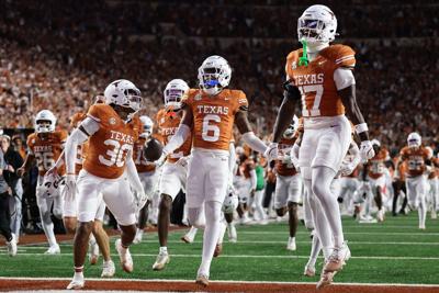 Kobe Black #6 of the Texas Longhorns celerbates a interception during the fourth quarter of a game against the Texas A&M Aggies at Darrell K Royal-Texas Memorial Stadium on Nov. 28, 2025, in Austin, Texas.