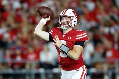 Billy Edwards Jr. of the Wisconsin Badgers drops back to pass in the first quarter against the Miami Redhawks at Camp Randall Stadium on Aug. 28, 2025, in Madison, Wisconsin.