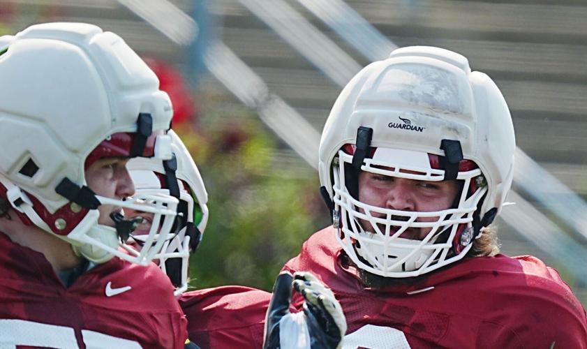 Iowa State offensive linemen Jake Taylor, right, and Trevor Bindel watch drills during the university’s football open practice