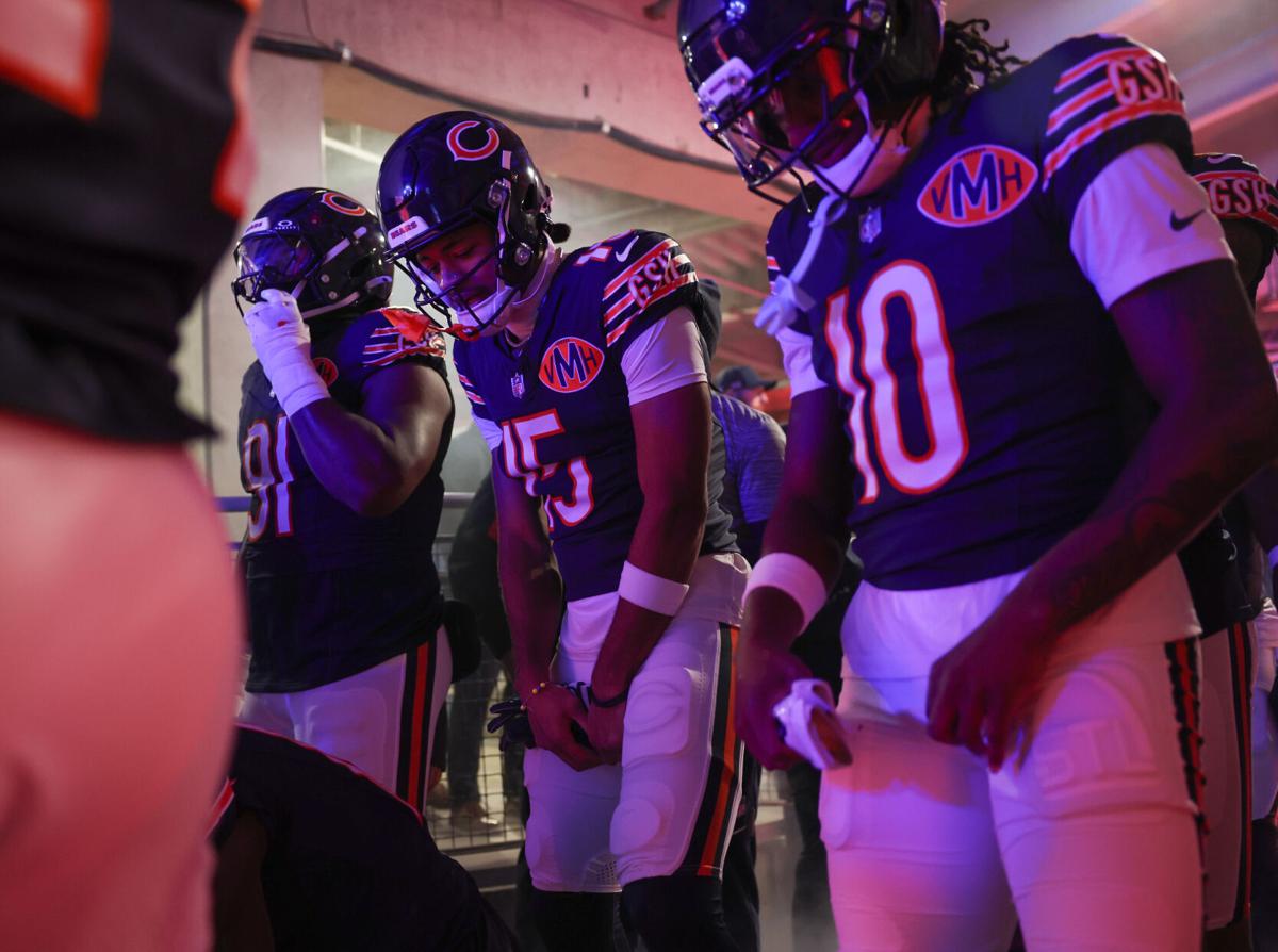 Bears wide receivers Rome Odunze (15) and Luther Burden III (10) wait to take the field against the Steelers on Nov. 23, 2025, at Soldier Field.