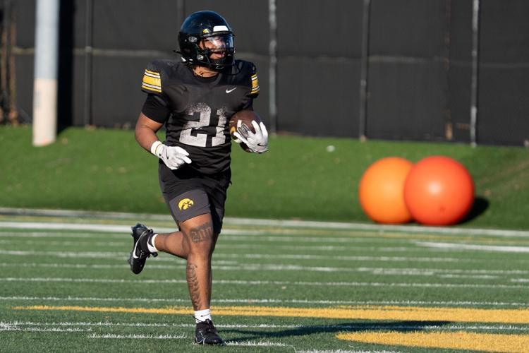 Iowa running back Lendon Phillips Jr. (21) carries the ball back to the line of scrimmage during practice April 9, 2026 in Iowa