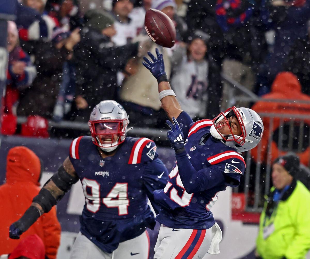 New England Patriots cornerback Marcus Jones celebrates his pick six during the second quarter of Sunday's Divisional Round win over the Houston Texans at Gillette Stadium.