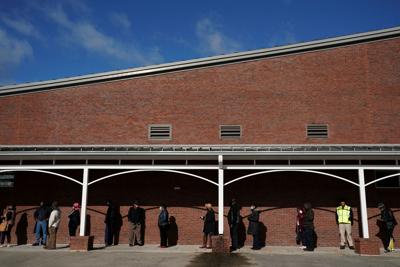 FILE PHOTO: Early voters queue to cast their votes in Georgia