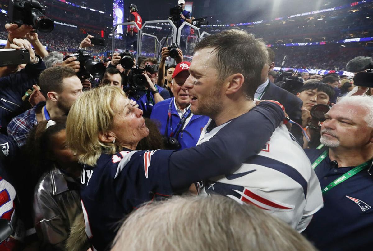 Tom Brady #12 of the New England Patriots hugs his mother Galynn after the Patriots defeat the Los Angeles Rams 13-3 during Super Bowl LIII at Mercedes-Benz Stadium on February 3, 2019 in Atlanta, Georgia.