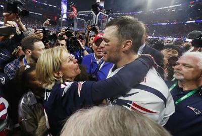 Tom Brady #12 of the New England Patriots hugs his mother Galynn after the Patriots defeat the Los Angeles Rams 13-3 during Super Bowl LIII at Mercedes-Benz Stadium on February 3, 2019 in Atlanta, Georgia.