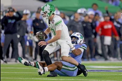 North Texas quarterback Drew Mestemaker is sacked for a 15- yard loss in the second quarter by Tulane defensive lineman Harvey Dyson III during the American Conference Football Championship at Yulman Stadium on Friday, Dec. 5, 2025, in New Orleans.