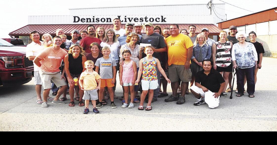 Thelma Pauley, Denison Livestock Auction, make donation to Crawford