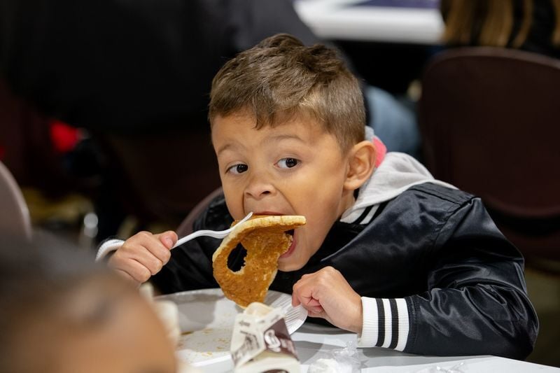 Eligio Welling, 5, enjoys a buttermilk pancake during the Maple Syrup Festival at the Big Knob Grange on Sunday, April 19, 2026.