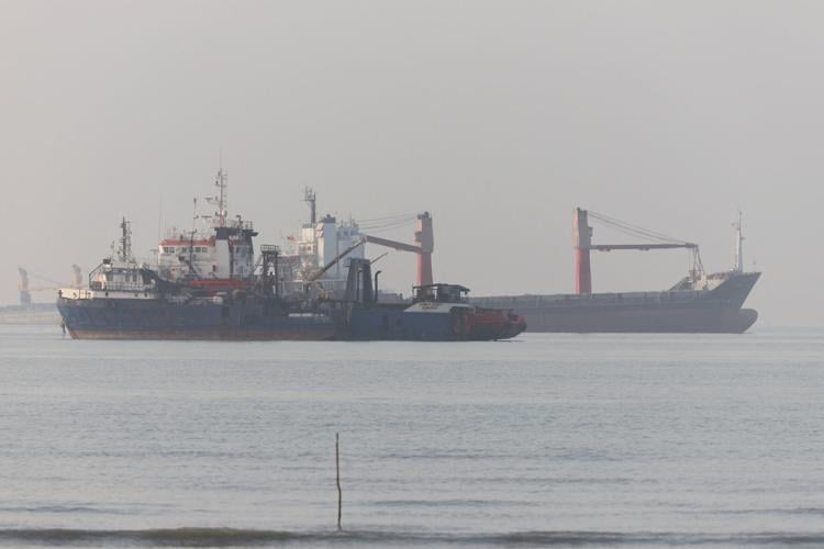 Vessels in the Strait of Hormuz are visible near the beach of Bandar Abbas
