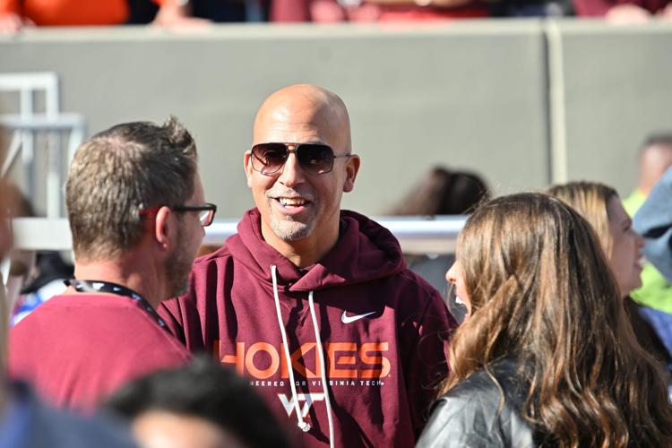 Nov 22, 2025; Blacksburg, Virginia, USA; Incoming head coach James Franklin speaks to fans on the sideline before the game at Lane Stadium. Mandatory Credit: Brian Bishop-Imagn Images