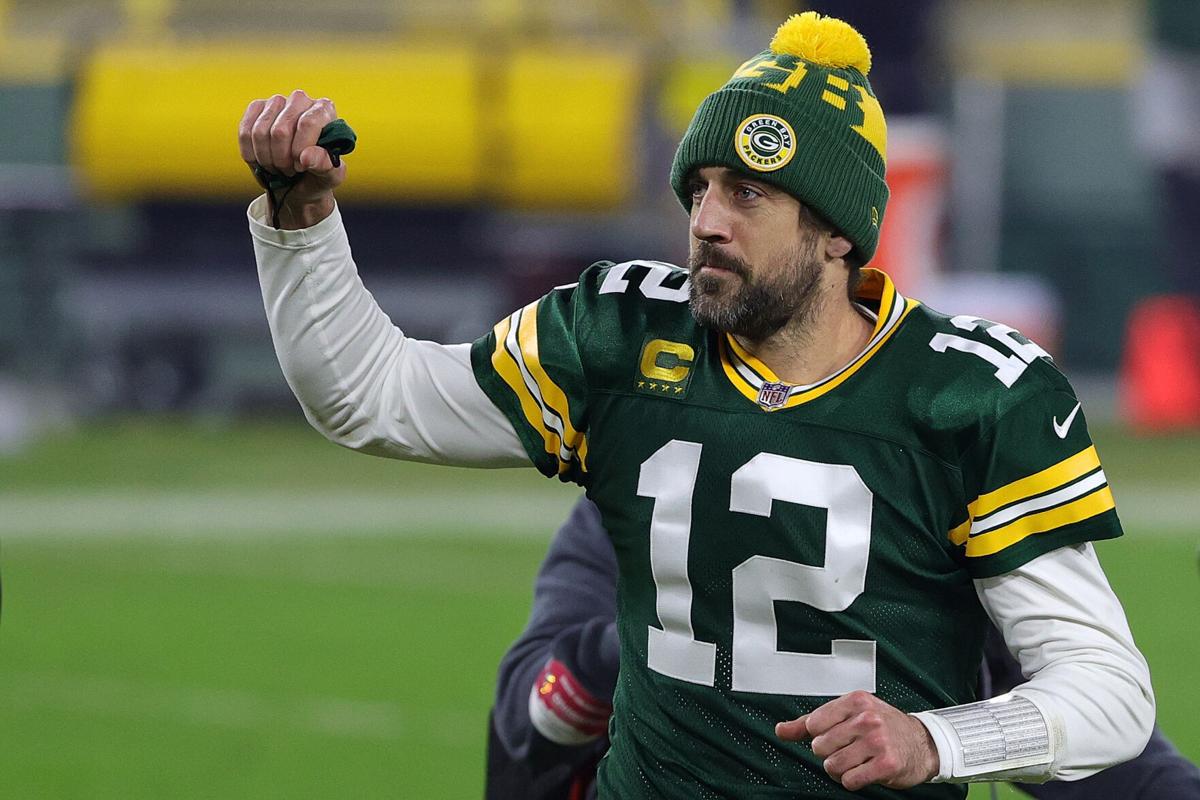 Aaron Rodgers #12 of the Green Bay Packers leaves the field following the NFC Divisional Playoff game against the Los Angeles Rams at Lambeau Field on Jan. 16, 2021 in Green Bay, Wisconsin.