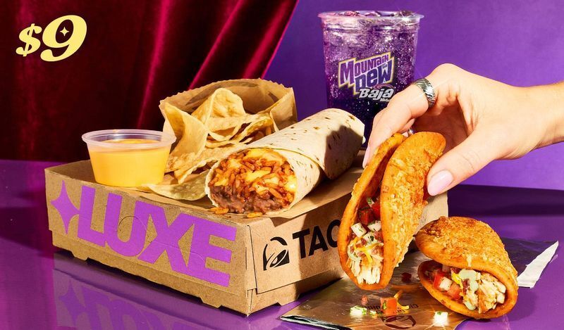 Taco Bell's $9 Discovery Luxe Box comes with two Chicken Bacon Ranch Street Chalupas, a Cheesy Bean and Rice Burrito, chips and nacho cheese sauce, and a medium fountain drink.