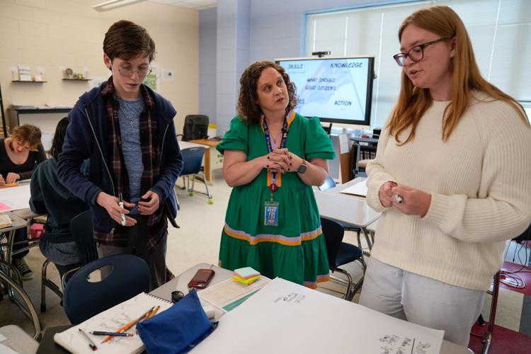 Alexandria City High School government instructor Amanda Kropp with students at Alexandria City High School. Policymakers across the country see the 250th anniversary as an opportunity to enhance civics education.