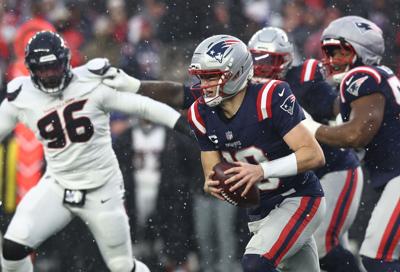 New England Patriots quarterback Drake Maye scrambles during the second quarter of the Divisional Round game at Gillette Stadium in Foxboro, Massachusetts.