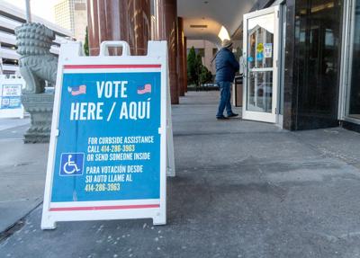A vote here sign is up at the Zeidler Municipal Building on West Broadway in Milwaukee, on April 7, 2026. Voters cast ballots in
