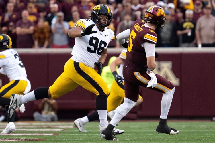 Iowa Hawkeyes defensive lineman Bryce Hawthorne (96) pressures Minnesota’s Drake Lindsey (5) Oct. 24, 2026 during a Big Ten