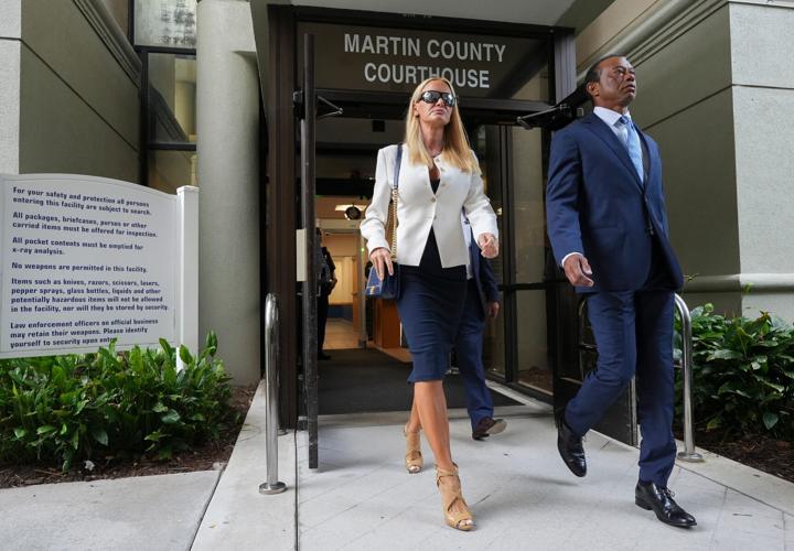 Tiger Woods leaves the Martin County Courthouse with girlfriend Vanessa Trump, Sept. 2, 2026, after a change of plea hearing