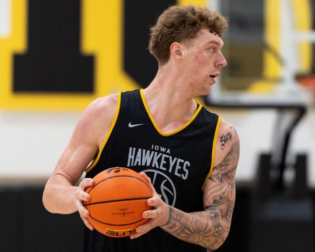 Iowa center Andrew McKeever looks to pass the ball during a summer basketball practice July 8, 2026 at Carver-Hawkeye Arena in