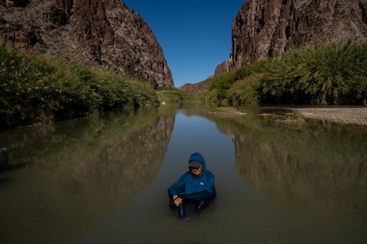 Mike Davidson rests in the middle of the Rio Grande at Big Bend Ranch State Park in West Texas on March 24, 2026. The river forms the international border between the United States and Mexico and flows through a remote region that consistently records some