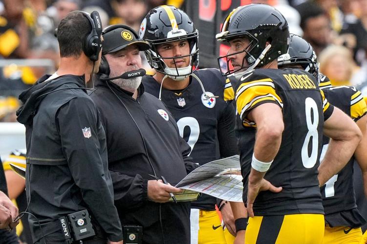 Pittsburgh Steelers quarterback Aaron Rodgers (8) checks with head coach Mike McCarthy after calling a timeout in the fourth