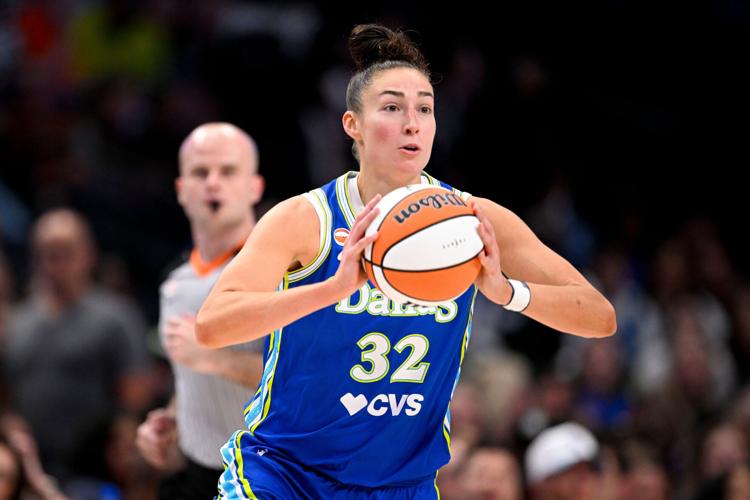 Dallas Wings forward Jessica Shepard (32) passes the ball during the first half against the Chicago Sky.
