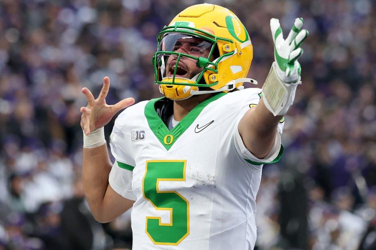 Dante Moore of the Oregon Ducks celebrates a touchdown during the second half against the Washington Huskies at Husky Stadium on Saturday, Nov. 29, 2025, in Seattle.