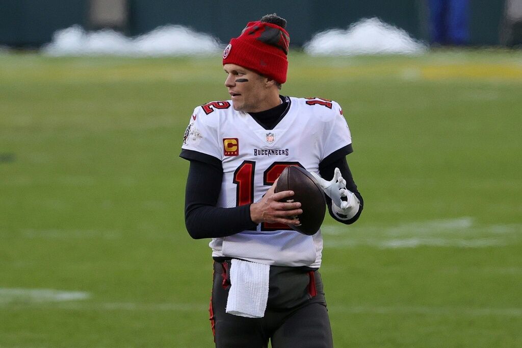 Tom Brady #12 of the Tampa Bay Buccaneers warms up prior to the third quarter during the NFC Championship game against the Green Bay Packers at Lambeau Field on Jan. 24, 2021 in Green Bay, Wisconsin.