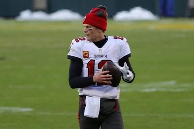 Tom Brady #12 of the Tampa Bay Buccaneers warms up prior to the third quarter during the NFC Championship game against the Green Bay Packers at Lambeau Field on Jan. 24, 2021 in Green Bay, Wisconsin.