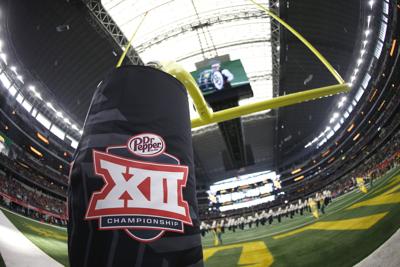 Detail view of Big 12 logo as the Baylor band plays on the field before the Bears play host to Oklahoma in the Big 12 Championship at AT&T Stadium in Arlington, Texas, on December 7, 2019.