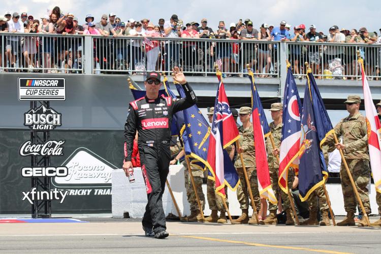Driver Kyle Busch is introduced ahead of the NASCAR Cup Series race at Pocono Raceway on Sunday, July 23, 2023. Busch won the