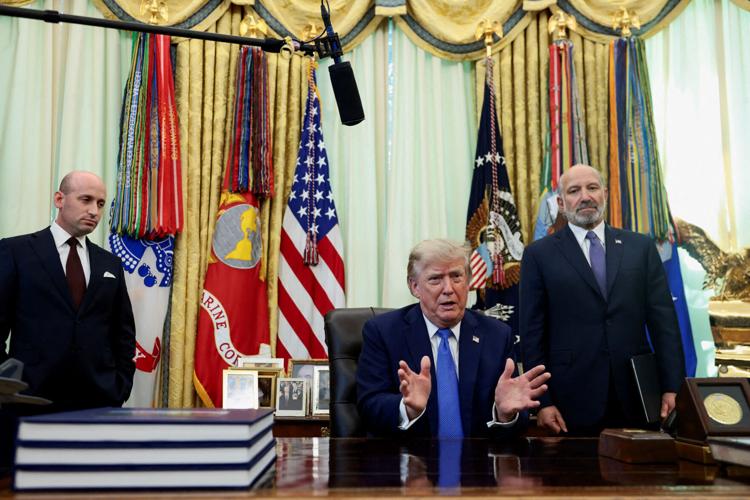 FILE PHOTO: U.S. President Donald Trump signs executive orders at the Oval Office in Washington