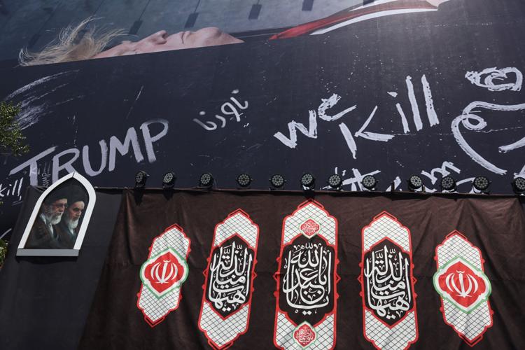 A billboard depicting U.S. President Donald Trump laid in a coffin is displayed on a building in Tehran