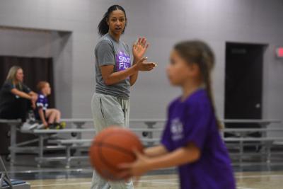 A Phoenix Mercury coach helps out at a clinic on April 24, in Sioux Falls, South Dakota.