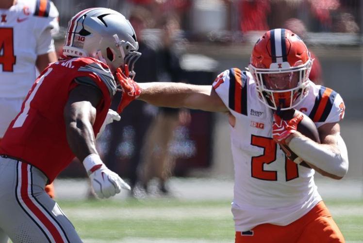 Sep 26, 2026; Columbus, Ohio, USA;  Illinois Fighting Illini running back Aidan Laughery (21) fights for yards as Ohio State Buckeyes safety Earl Little Jr. (1) pursues at Ohio Stadium.  Mandatory Credit: Joseph Maiorana-Imagn Images