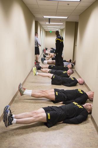 Soldiers from the 289th Millitary Policy Company conduct physical training