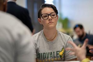 Parents and children protesting outside DeKalb County school meeting