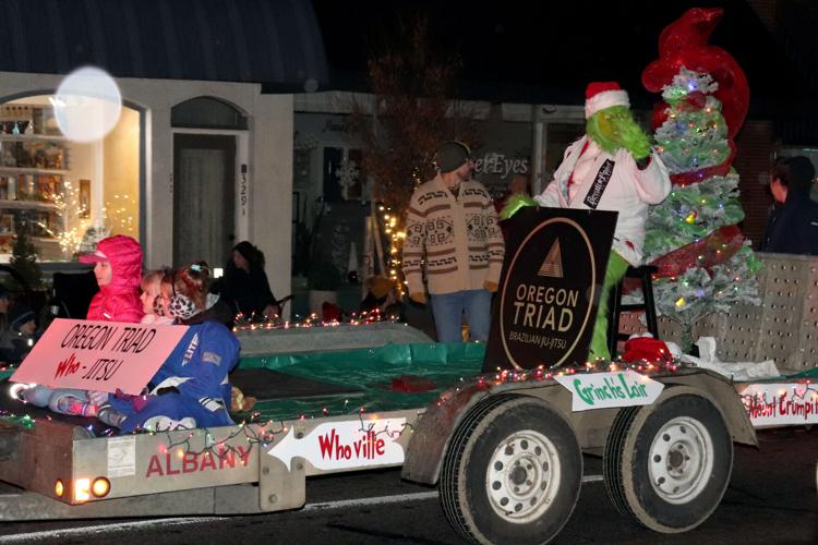 Sidewalks a hot tub) packed for Albany Christmas parade